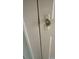 Close-up of a vintage crystal doorknob and white door at 411 Maplewood Dr, Walterboro, SC 29488
