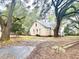 Charming home exterior with mature trees and front yard at 411 Maplewood Dr, Walterboro, SC 29488