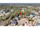 High-angle view of a home nestled among mature trees, showcasing the surrounding community and a tranquil pond at 4983 Sound View Dr, Mount Pleasant, SC 29466