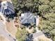 Stunning aerial view of a home showcasing its elegant roof, lush landscaping, and surrounding neighborhood at 4983 Sound View Dr, Mount Pleasant, SC 29466