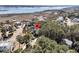Breathtaking aerial view of a house surrounded by lush trees near a serene body of water at 4983 Sound View Dr, Mount Pleasant, SC 29466