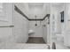 Spacious shower with tile surround, bench seat, and modern fixtures at 4983 Sound View Dr, Mount Pleasant, SC 29466