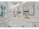 Bright bathroom featuring dual sinks, framed mirrors, natural light, and a toilet at 4983 Sound View Dr, Mount Pleasant, SC 29466