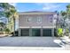 Three car garage with spacious driveway offers ample parking at 4983 Sound View Dr, Mount Pleasant, SC 29466