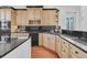 Well-lit kitchen with granite counters, light wood cabinets, and modern appliances at 4983 Sound View Dr, Mount Pleasant, SC 29466