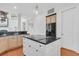 Open concept kitchen with island, stainless steel appliances, and a view to the living area at 4983 Sound View Dr, Mount Pleasant, SC 29466