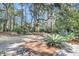 Picturesque backyard featuring lush landscaping, mature trees, and a blend of natural beauty at 4983 Sound View Dr, Mount Pleasant, SC 29466