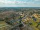 Aerial view of a residential neighborhood shows the layout and surrounding trees at 5037 Govan Rd, Hollywood, SC 29449
