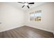 Bright bedroom features wood-look flooring and a large window with natural light at 5037 Govan Rd, Hollywood, SC 29449