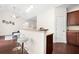 Open kitchen featuring granite breakfast bar, stainless appliances and natural light at 5037 Govan Rd, Hollywood, SC 29449