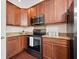 A kitchen features granite countertops and wooden cabinets, as well as a microwave and black oven at 5037 Govan Rd, Hollywood, SC 29449