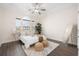 Well-lit bedroom with a ceiling fan, a bed, and a window offering plenty of natural light at 5037 Govan Rd, Hollywood, SC 29449