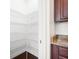 Walk-in pantry with wire shelving provides ample storage space, adjacent to granite countertops at 5037 Govan Rd, Hollywood, SC 29449