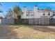 Backyard view highlighting the wooden fence and neighboring townhomes at 509 Reserve Way, Summerville, SC 29485