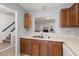 Kitchen view with a view into the living room with a fireplace and staircase at 509 Reserve Way, Summerville, SC 29485