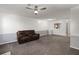 Living area showcases open floor plan with view to kitchen, eating area, and leather sofa at 509 Reserve Way, Summerville, SC 29485