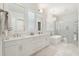 Luxury bathroom with dual sinks, a soaking tub, and a marble surround shower at 5742 Kiawah River Dr, Johns Island, SC 29455