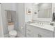 Clean bathroom featuring white cabinetry, modern fixtures, and bright natural light at 5742 Kiawah River Dr, Johns Island, SC 29455