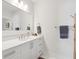 Bright bathroom featuring a marble countertop, a large mirror, and modern fixtures at 5742 Kiawah River Dr, Johns Island, SC 29455