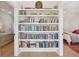 Floor to ceiling bookshelf between two bedroom entries, creating architectural interest and added storage space at 5742 Kiawah River Dr, Johns Island, SC 29455