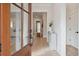 Bright foyer showcasing hardwood floors, a decorative console table, and an open view of the home's layout at 5742 Kiawah River Dr, Johns Island, SC 29455