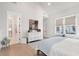 Spacious main bedroom with ample natural light and ensuite bathroom at 5742 Kiawah River Dr, Johns Island, SC 29455