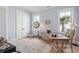 Bright office space with a desk, and natural light from the windows at 5742 Kiawah River Dr, Johns Island, SC 29455