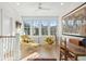 Comfortable sitting area with natural light, mid-century modern chairs and tree views at 5742 Kiawah River Dr, Johns Island, SC 29455