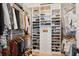 Custom walk-in closet with built-in shelving, hanging racks, and ample storage for clothes and accessories at 5742 Kiawah River Dr, Johns Island, SC 29455