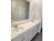 Bathroom with a double sink vanity, modern fixtures, and a large mirror at 598 Red Monarch Way, Moncks Corner, SC 29461