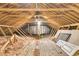 Unfinished attic space featuring exposed beams and ample room for storage or customization at 6294 Highway 165, Ravenel, SC 29470