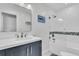 Modern bathroom features a combination shower and tub with glass enclosure and updated vanity at 6294 Highway 165, Ravenel, SC 29470