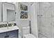 Modern bathroom features a sleek vanity, marble-tiled shower, and a window providing natural light at 6294 Highway 165, Ravenel, SC 29470