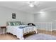 Spacious bedroom featuring a fan, a comfortable bed, and staircase at 6294 Highway 165, Ravenel, SC 29470