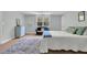 Well-lit bedroom featuring a cozy window seat, comfortable bed, and a plush rug at 6294 Highway 165, Ravenel, SC 29470