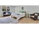 Bright bedroom with a comfortable bed, wicker seating, and a soft rug for a cozy feel at 6294 Highway 165, Ravenel, SC 29470