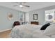 Comfortable bedroom featuring a metal frame bed, dresser, and a bright ensuite bathroom at 6294 Highway 165, Ravenel, SC 29470