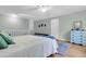 Spacious bedroom featuring a lofted railing, a comfortable bed, and bright natural light at 6294 Highway 165, Ravenel, SC 29470
