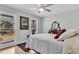 Sunlit bedroom with hardwood floors, bright windows, and relaxing decor at 6294 Highway 165, Ravenel, SC 29470