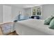 Comfortable bedroom featuring a cozy window seat, plush rug, and abundant natural light at 6294 Highway 165, Ravenel, SC 29470