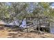 Waterfront dock surrounded by mature trees with a kayak nearby at 6294 Highway 165, Ravenel, SC 29470