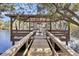 Lakeside dock featuring seating area, wood plank floor and vaulted ceiling at 6294 Highway 165, Ravenel, SC 29470