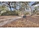 Sign with address number and long driveway leading to the home at 6294 Highway 165, Ravenel, SC 29470