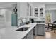 Modern kitchen featuring quartz countertops, grey cabinets, stainless steel appliances, and tile backsplash at 6294 Highway 165, Ravenel, SC 29470