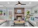 Inviting living room features brick fireplace, door to patio, and decorative plant at 6294 Highway 165, Ravenel, SC 29470