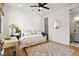 Bright bedroom featuring hardwood floors, natural light, and a functional desk area at 721 Meeting St, Charleston, SC 29403