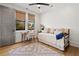 Cozy bedroom with hardwood floors, natural light, and a comfortable daybed at 721 Meeting St, Charleston, SC 29403