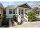Charming home featuring a covered front porch, manicured landscaping, and stylish architectural details at 721 Meeting St, Charleston, SC 29403