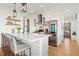 Bright and modern kitchen featuring stainless steel appliances, a breakfast bar, and ample storage at 721 Meeting St, Charleston, SC 29403