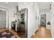 Bright kitchen with a stainless-steel refrigerator, oven, and a view to the outside from the door at 721 Meeting St, Charleston, SC 29403